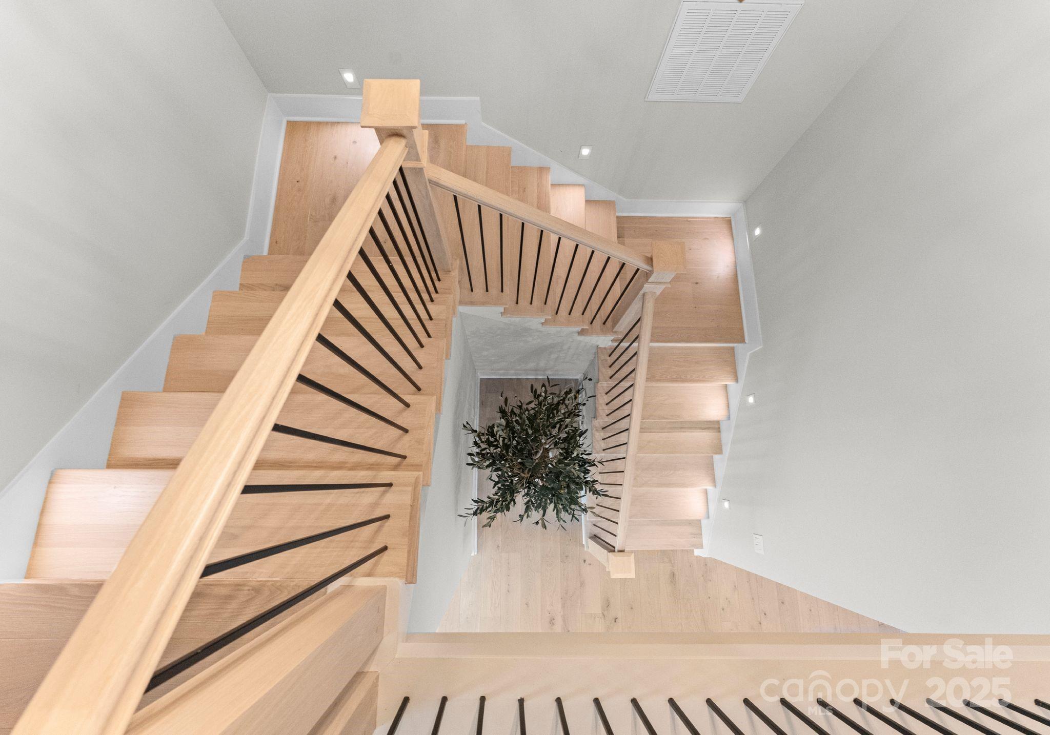 19405 Coachmans Trace Cornelius, NC 28031 - Photo 26 of 44 a view of entryway and hall with wooden floor