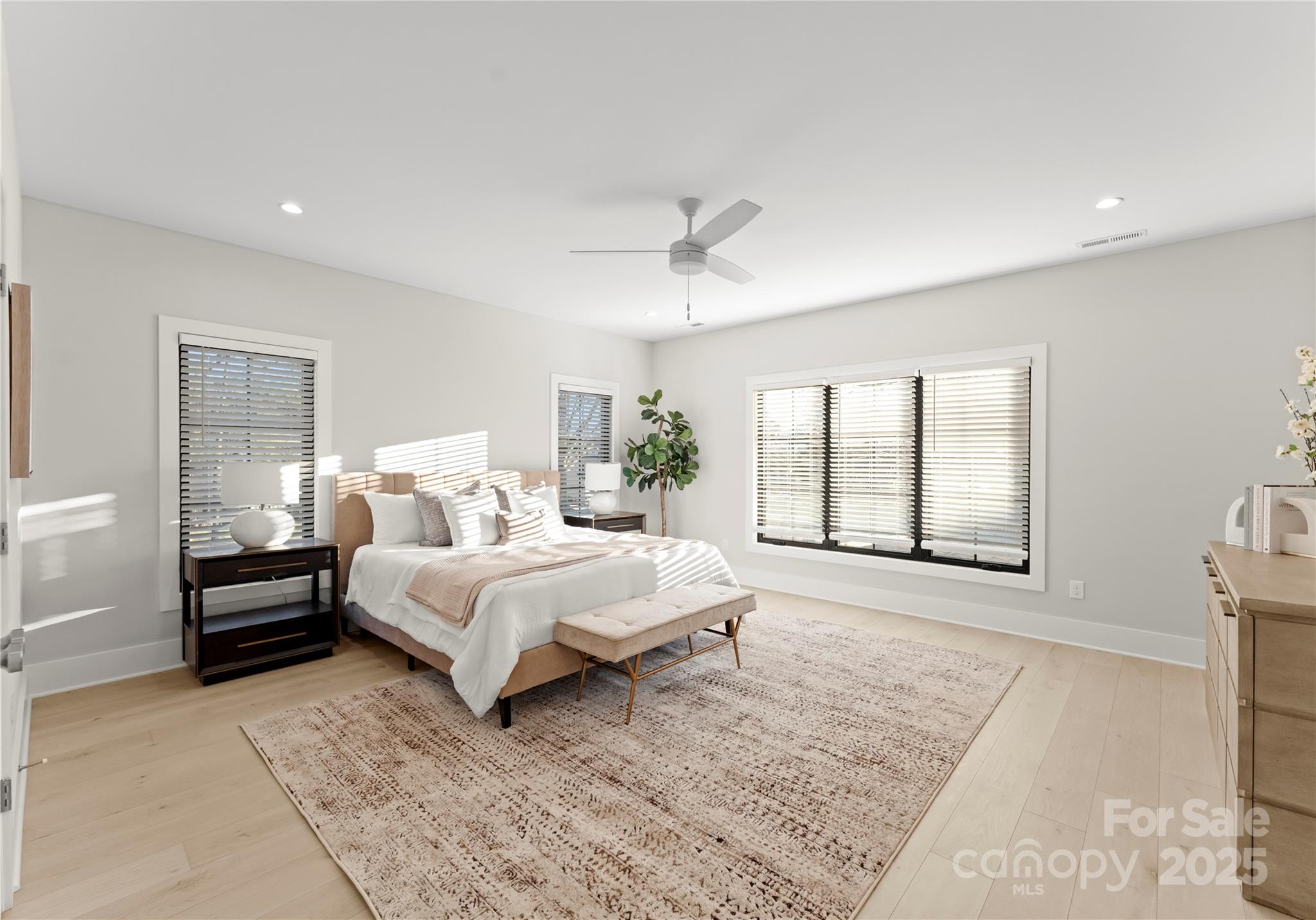 19405 Coachmans Trace Cornelius, NC 28031 - Photo 27 of 44 a bed room with a bed and a large window