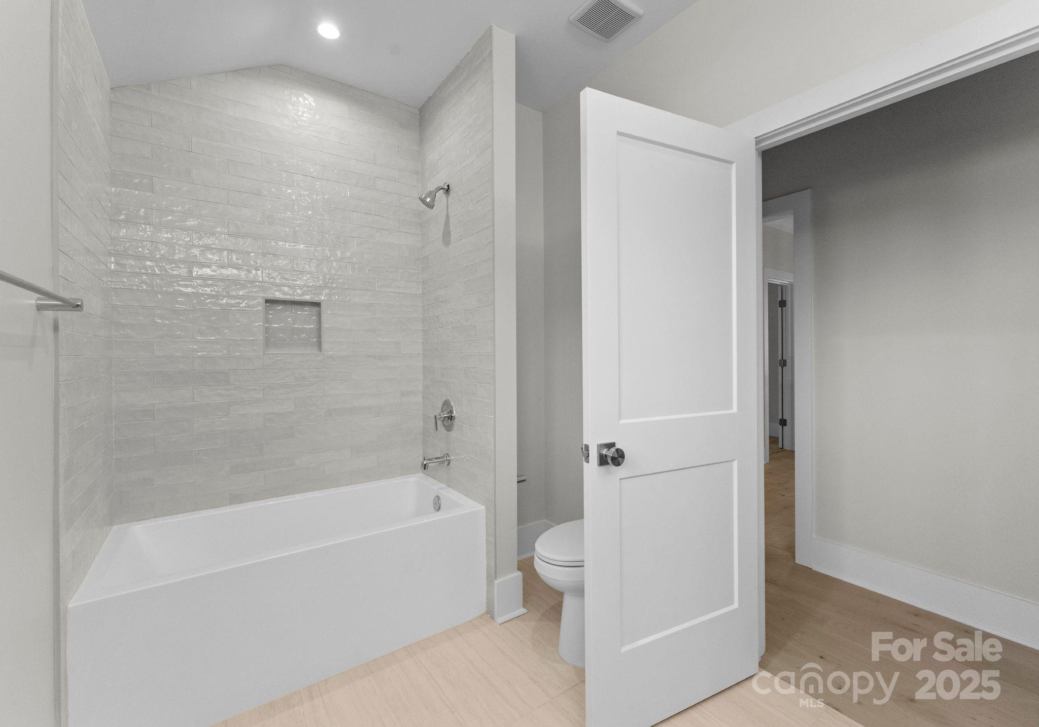 19405 Coachmans Trace Cornelius, NC 28031 - Photo 37 of 44 a bathroom with a bathtub and a shower