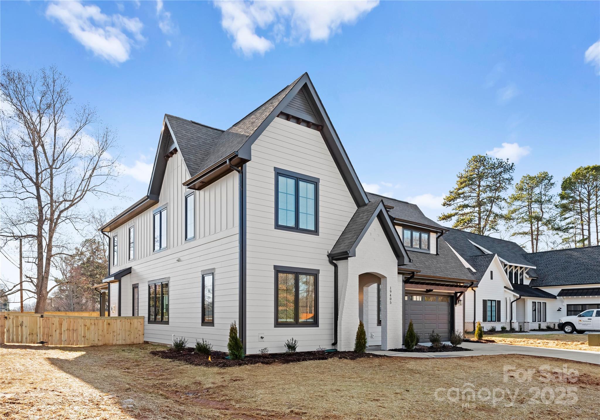 19405 Coachmans Trace Cornelius, NC 28031 - Photo 4 of 44 a front view of a house with a yard