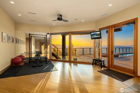 a living room with couch and floor to ceiling window