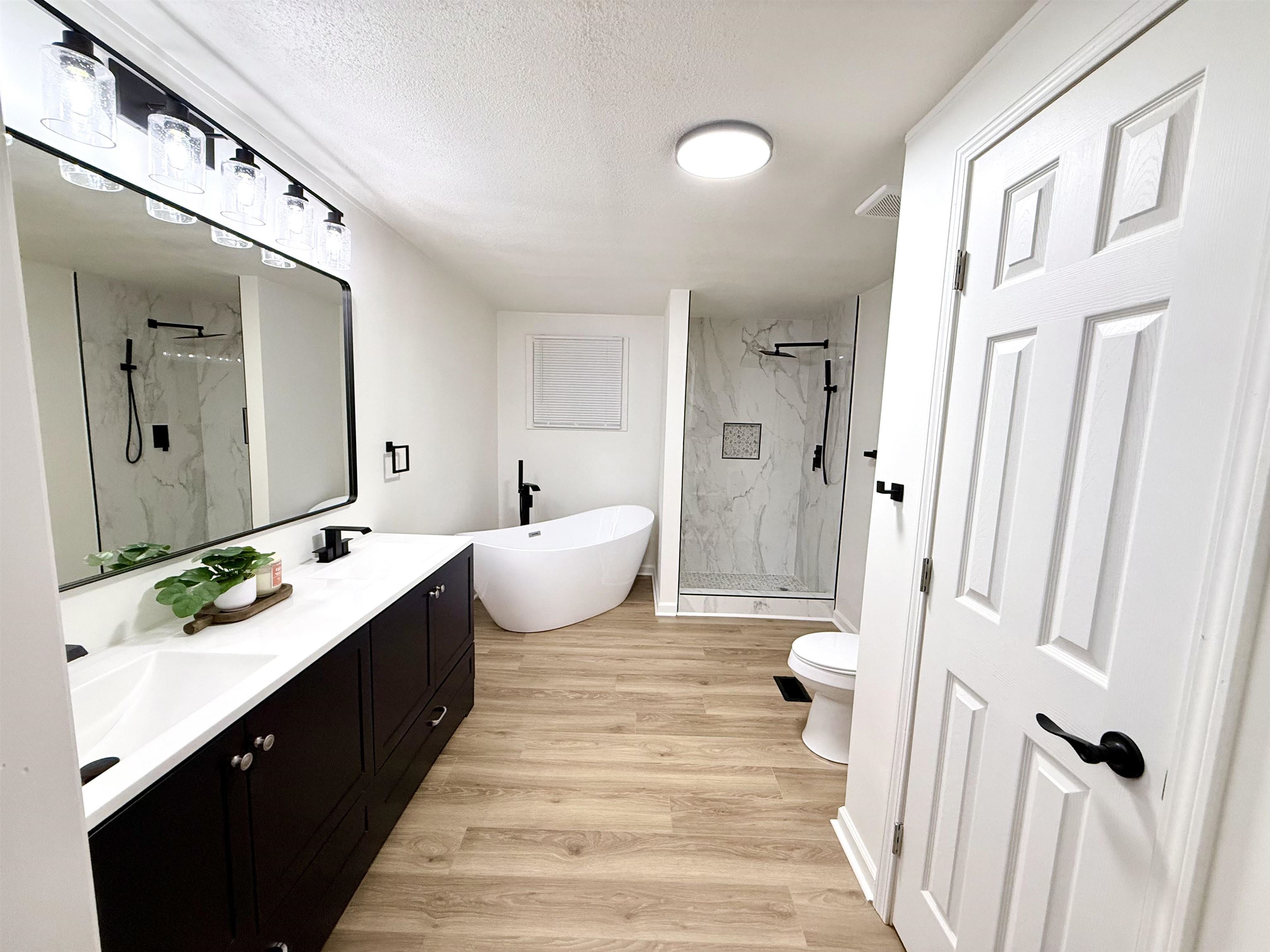800 Highway 59 Mason, TN 38049 - Photo 8 of 11 a spacious bathroom with a double vanity sink and a mirror