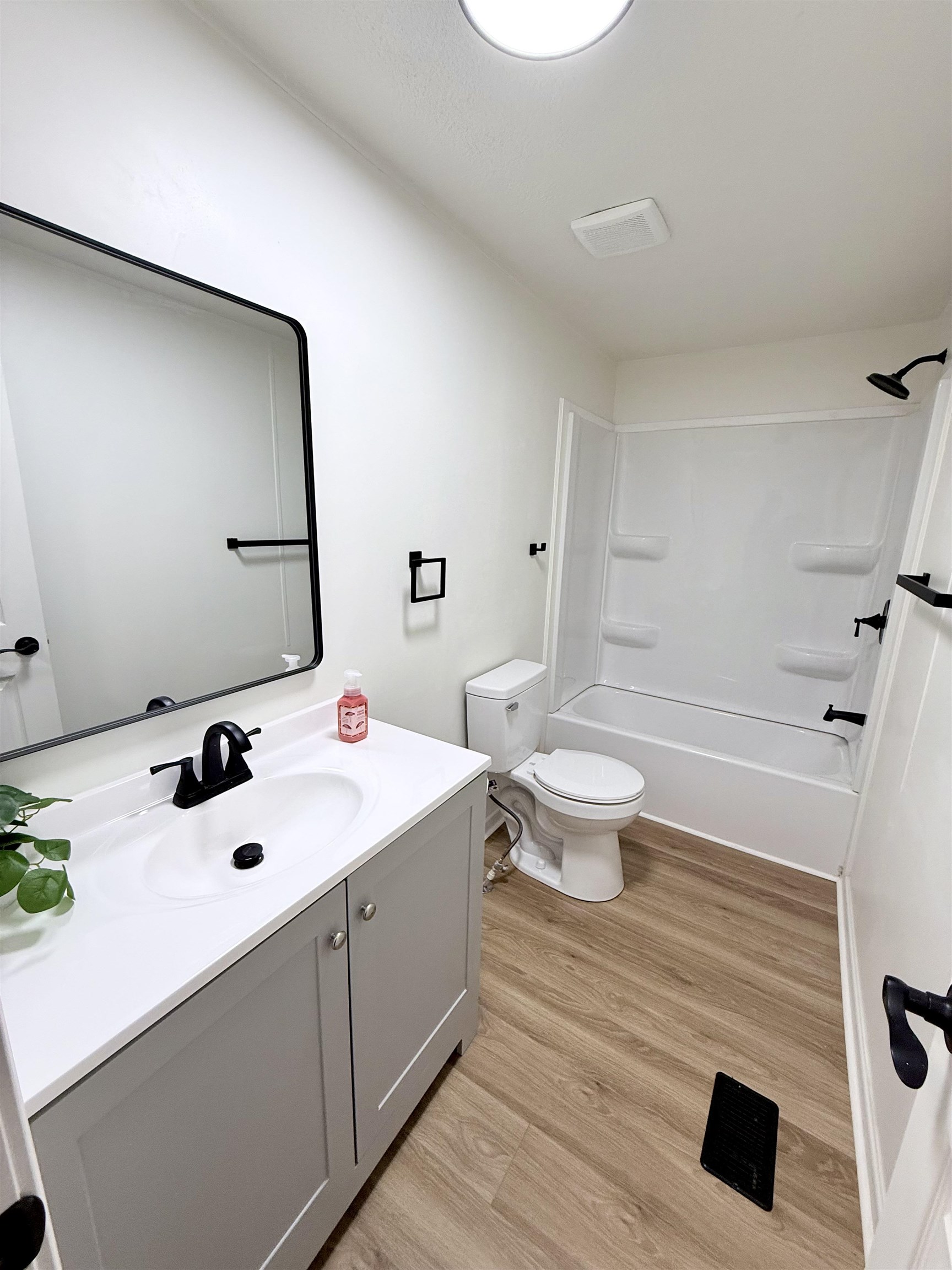 800 Highway 59 Mason, TN 38049 - Photo 9 of 11 a bathroom with a sink a toilet and a mirror