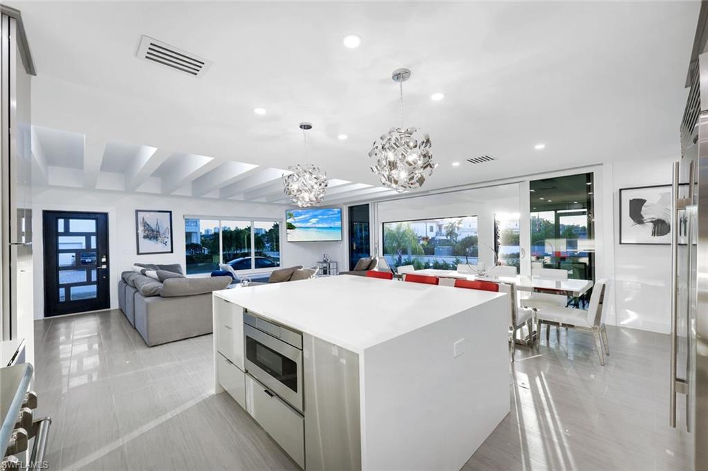 10002 Vanderbilt Drive Naples, FL 34108 - Photo 12 of 42 Open concept all the way to your screened-in lanai