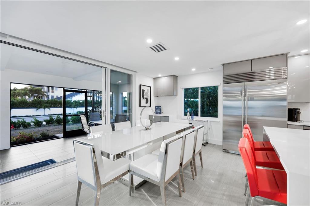 10002 Vanderbilt Drive Naples, FL 34108 - Photo 14 of 42 Beautiful dining area complete with a canal water view!