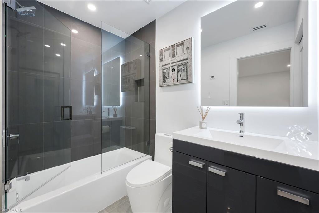 10002 Vanderbilt Drive Naples, FL 34108 - Photo 21 of 42 Grey tone and white bathroom
