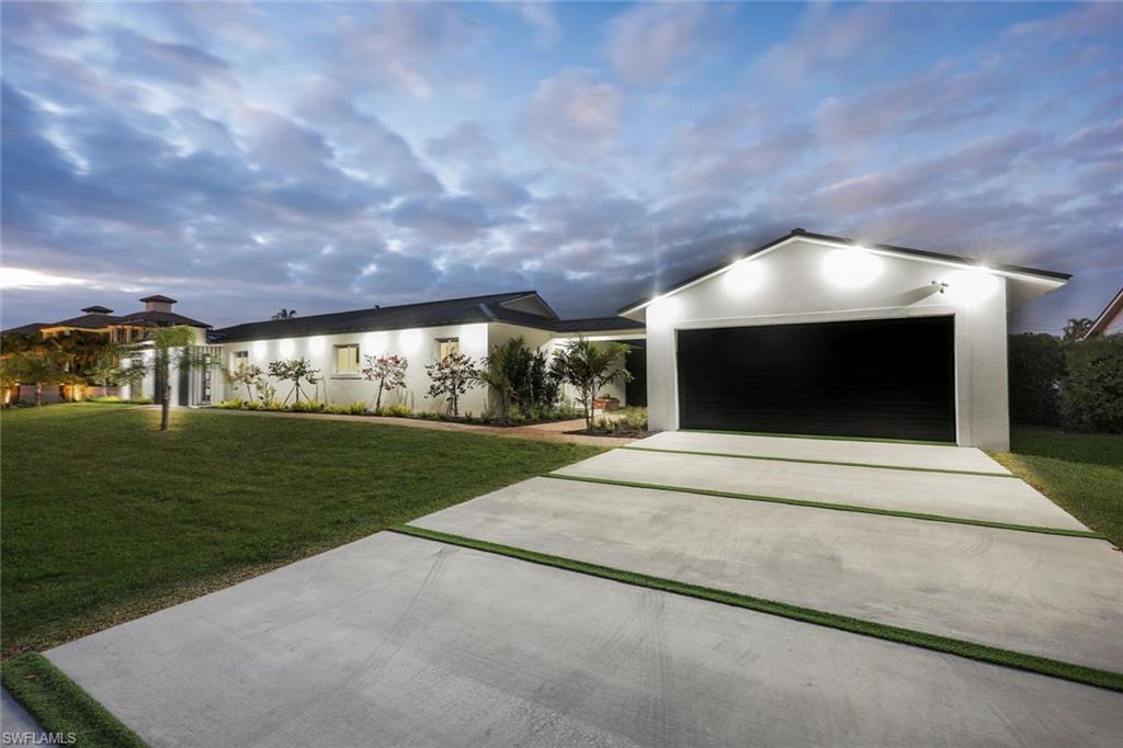 10002 Vanderbilt Drive Naples, FL 34108 - Photo 25 of 42 2 car garage with ample space in the driveway.