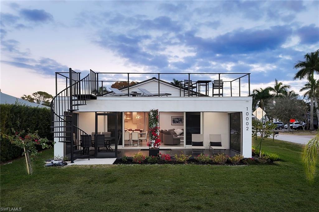 10002 Vanderbilt Drive Naples, FL 34108 - Photo 26 of 42 Spiral staircase adds to the bold design