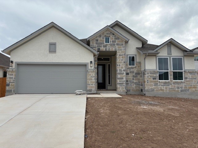 18909 Hopper Lane Austin, TX 78738 - Photo 1 of 1 a front view of a house with garage