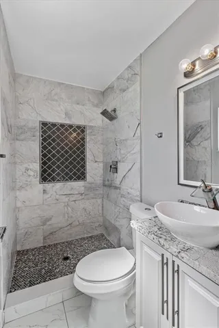 a bathroom with a bathtub and shower