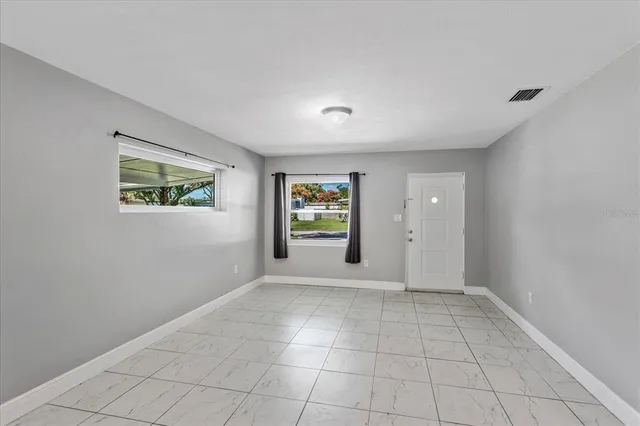 an empty room with windows