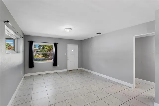 a view of an empty room and window