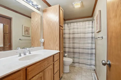 a bedroom with furniture and window