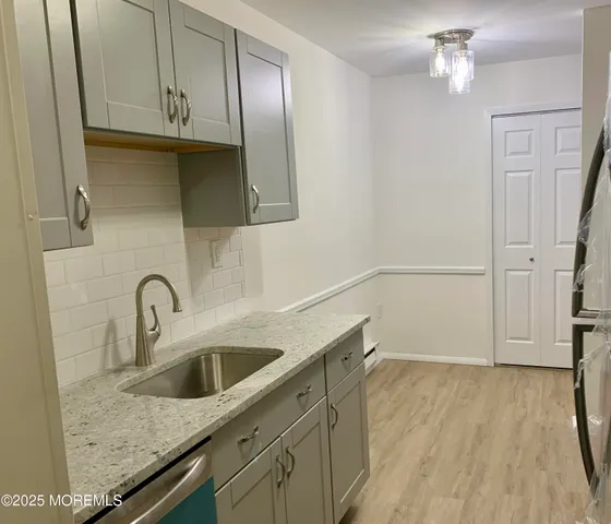 a close view of a sink a faucet and appliance in the kitchen