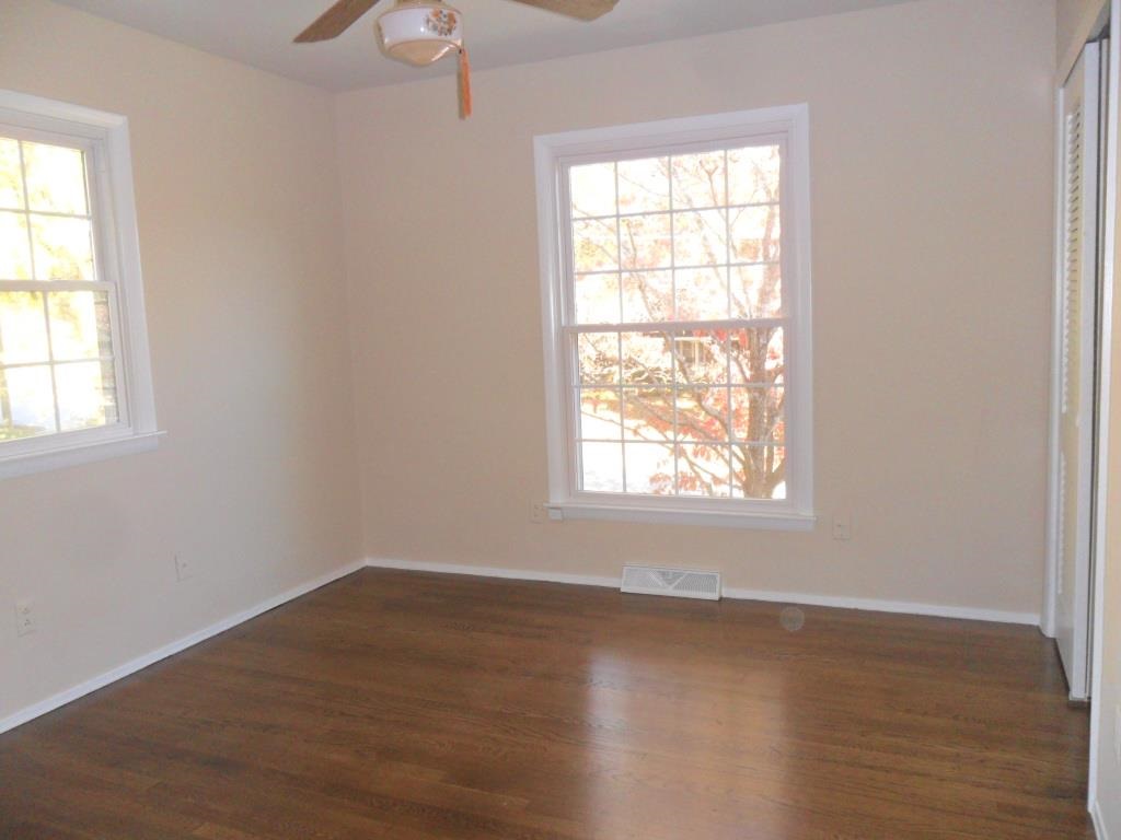 524 Harvard Street Raleigh, NC 27609 - Photo 16 of 25 Bedroom upstairs with refinished floors.