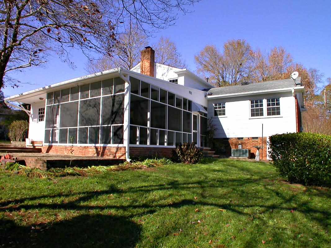 524 Harvard Street Raleigh, NC 27609 - Photo 22 of 25 Exterior back picture. HVAC is 2012. 50 year shingle on this home. Very well maintained