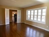 524 Harvard Street Raleigh, NC 27609 - Photo 5 of 25 Very spacious living area with the Oak hardwoods refinished. The huge bay window was installed by Park Avenue windows per the owner of the property.
