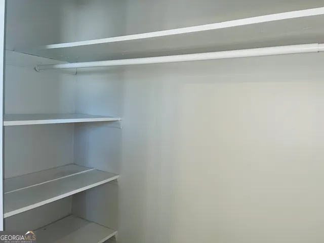 a view of an empty walk in closet
