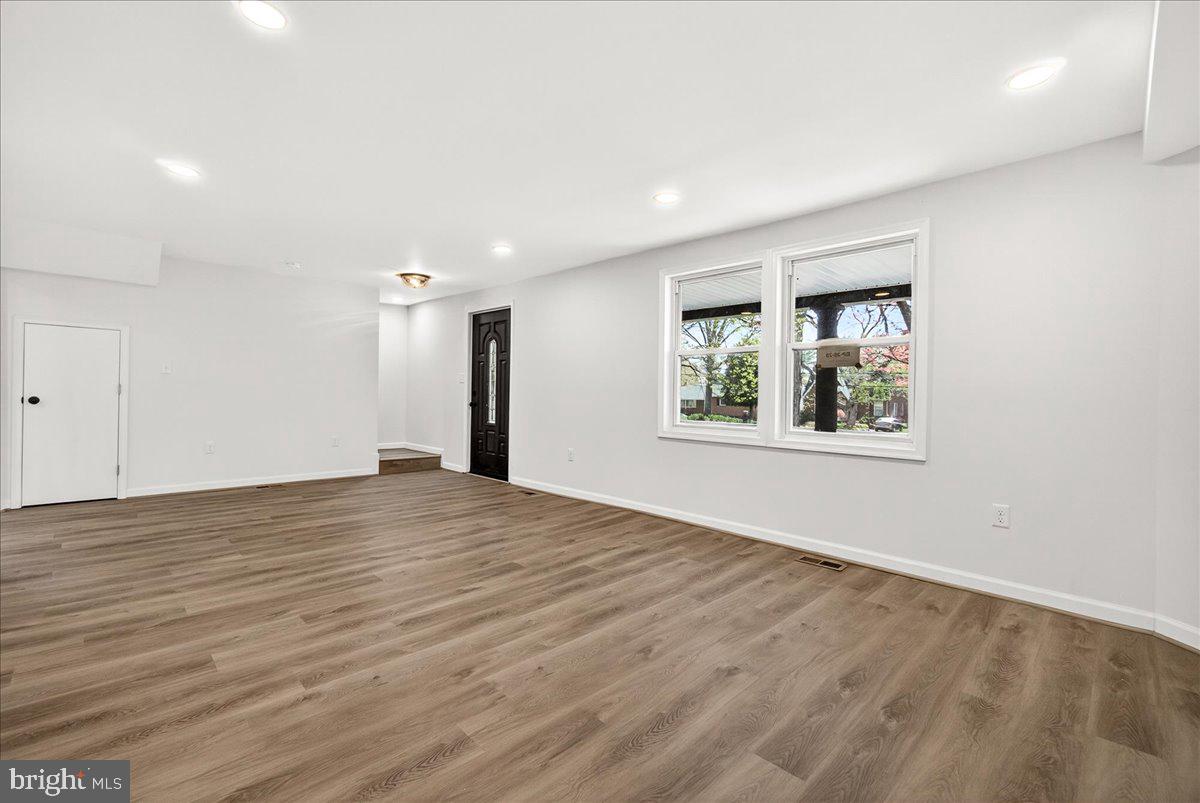 629 Wilson Place Frederick, MD 21702 - Photo 11 of 39 wooden floor in an empty room with a window