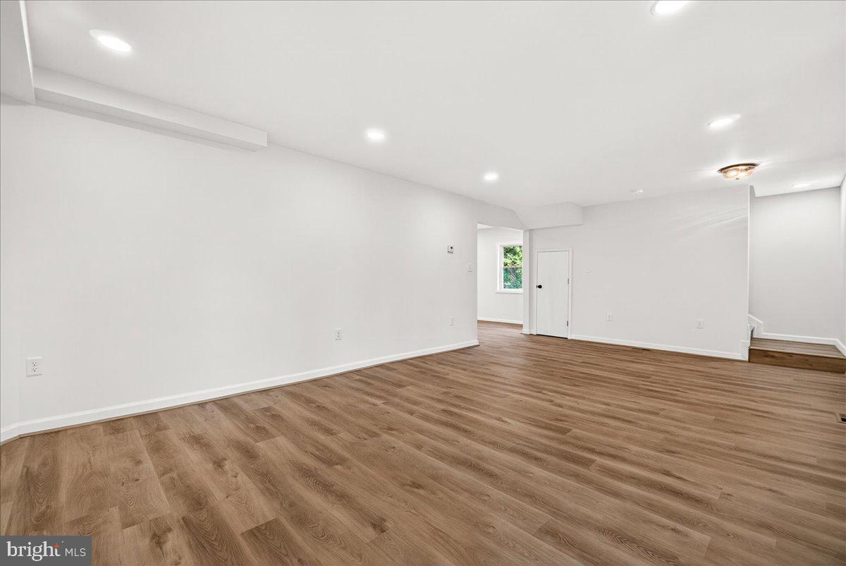 629 Wilson Place Frederick, MD 21702 - Photo 12 of 39 a view of empty room with wooden floor