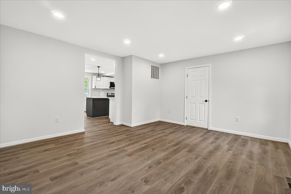 629 Wilson Place Frederick, MD 21702 - Photo 14 of 39 a view of empty room with wooden floor