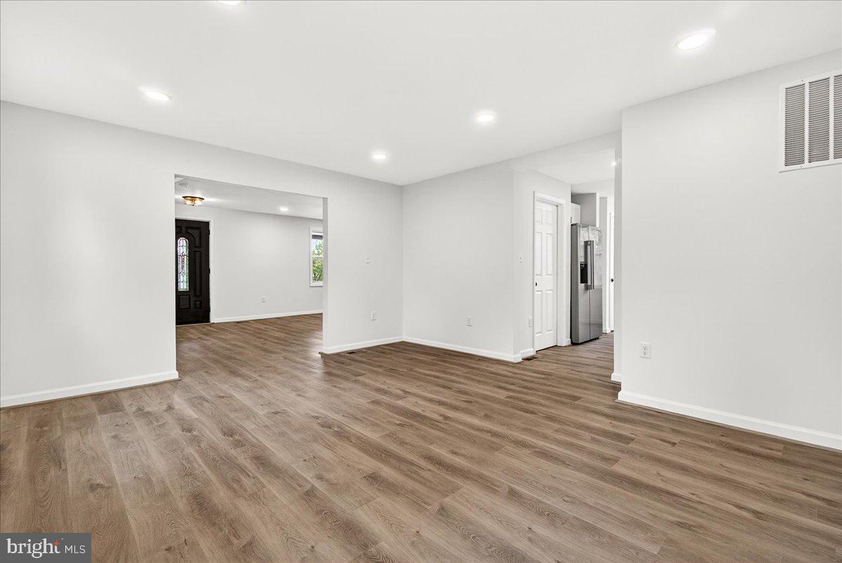 629 Wilson Place Frederick, MD 21702 - Photo 15 of 39 a view of an empty room with wooden floor and closet