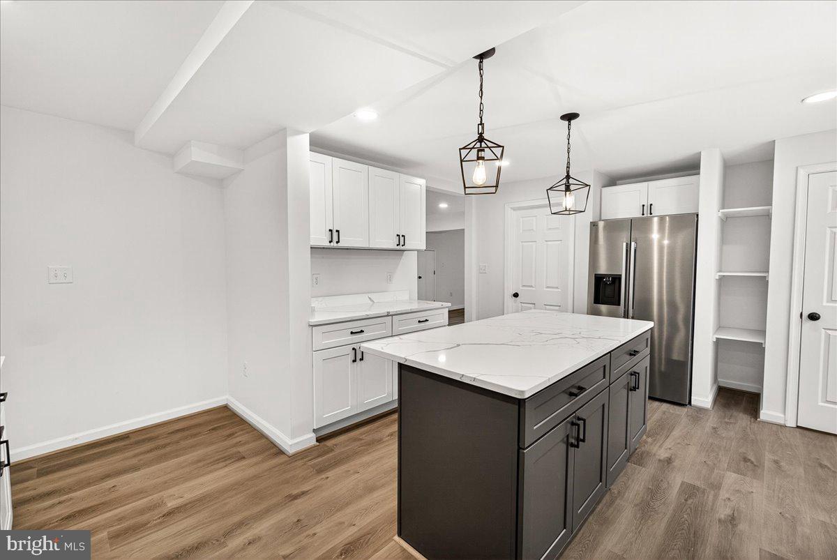 629 Wilson Place Frederick, MD 21702 - Photo 17 of 39 a kitchen that has a lot of cabinets in it