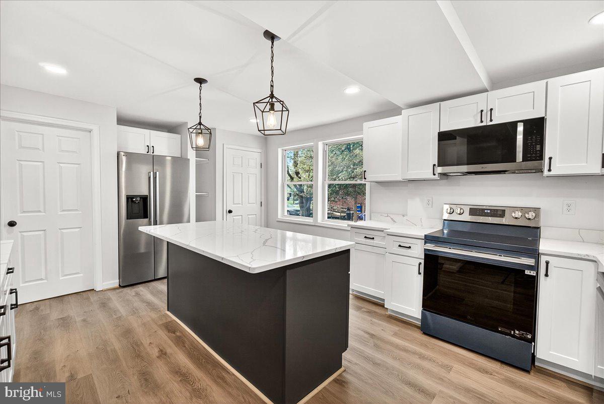 629 Wilson Place Frederick, MD 21702 - Photo 19 of 39 a kitchen with a sink stove and microwave