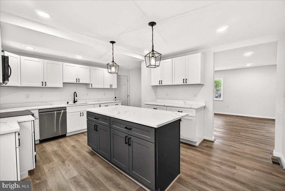 629 Wilson Place Frederick, MD 21702 - Photo 20 of 39 a kitchen with a sink window and cabinets