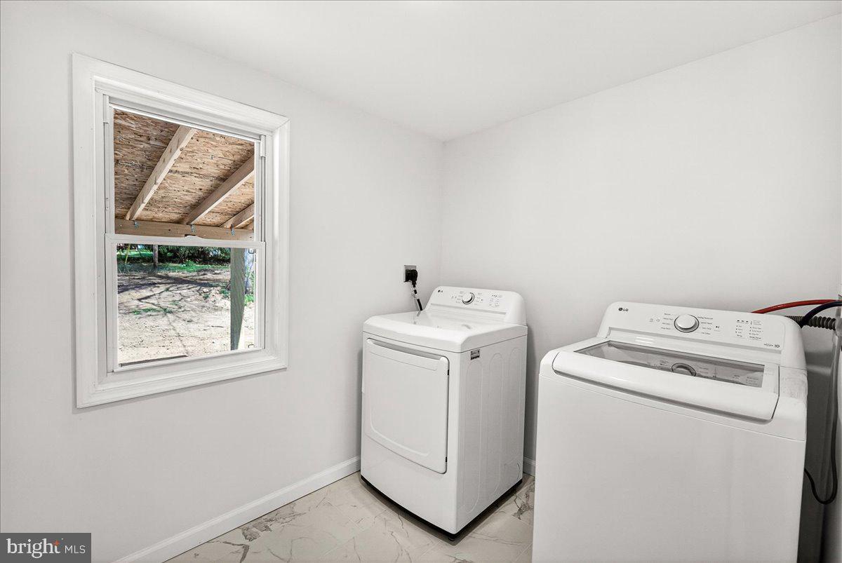 629 Wilson Place Frederick, MD 21702 - Photo 22 of 39 a utility room with dryer and washer