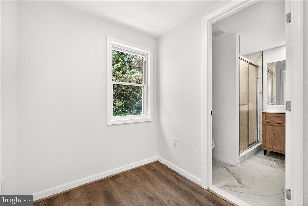629 Wilson Place Frederick, MD 21702 - Photo 29 of 39 an empty room with windows and closet