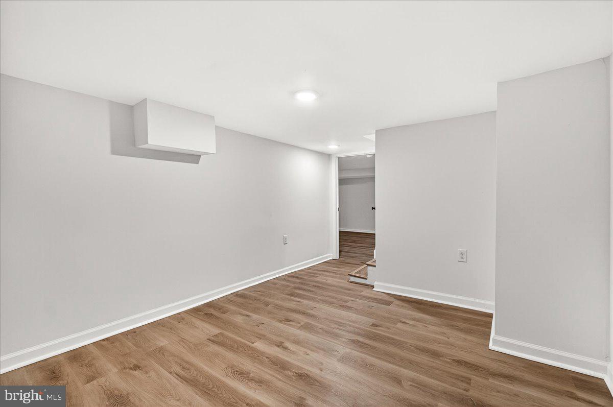 629 Wilson Place Frederick, MD 21702 - Photo 36 of 39 a view of an empty room with wooden floor