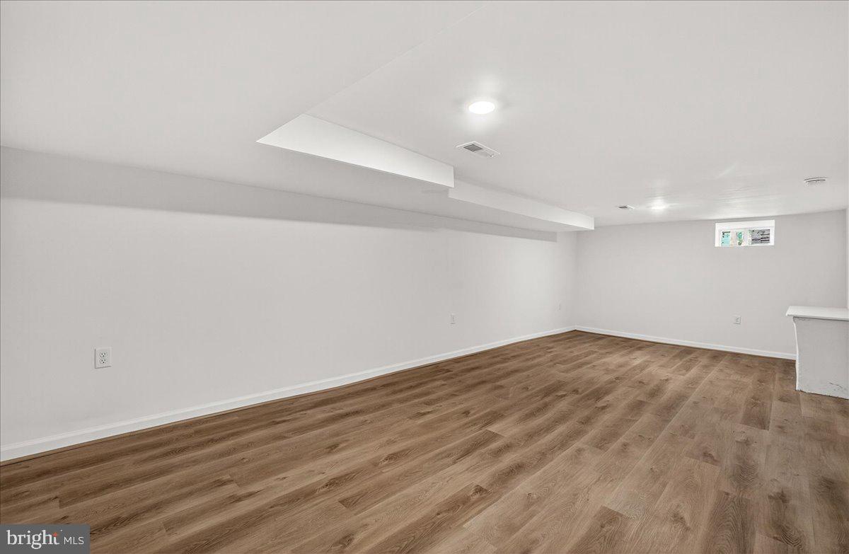 629 Wilson Place Frederick, MD 21702 - Photo 37 of 39 a view of empty room with wooden floor