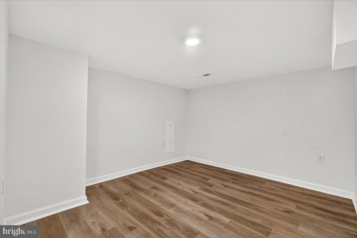 629 Wilson Place Frederick, MD 21702 - Photo 38 of 39 a view of an empty room with wooden floor