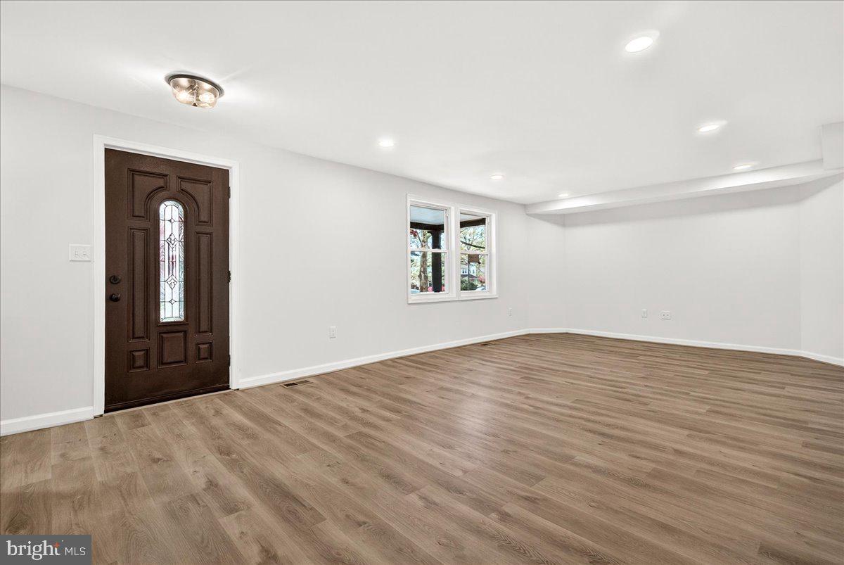 629 Wilson Place Frederick, MD 21702 - Photo 10 of 39 a view of empty room with wooden floor and fan