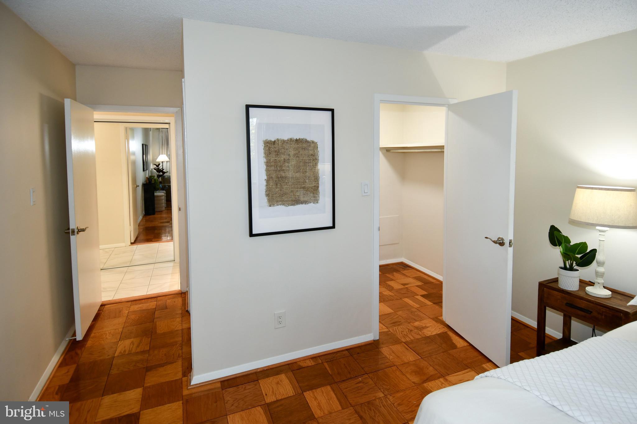 5225 Pooks Hill Road, Unit 222N Bethesda, MD 20814 - Photo 22 of 45 a bedroom with a bed and the view of en suite bathroom
