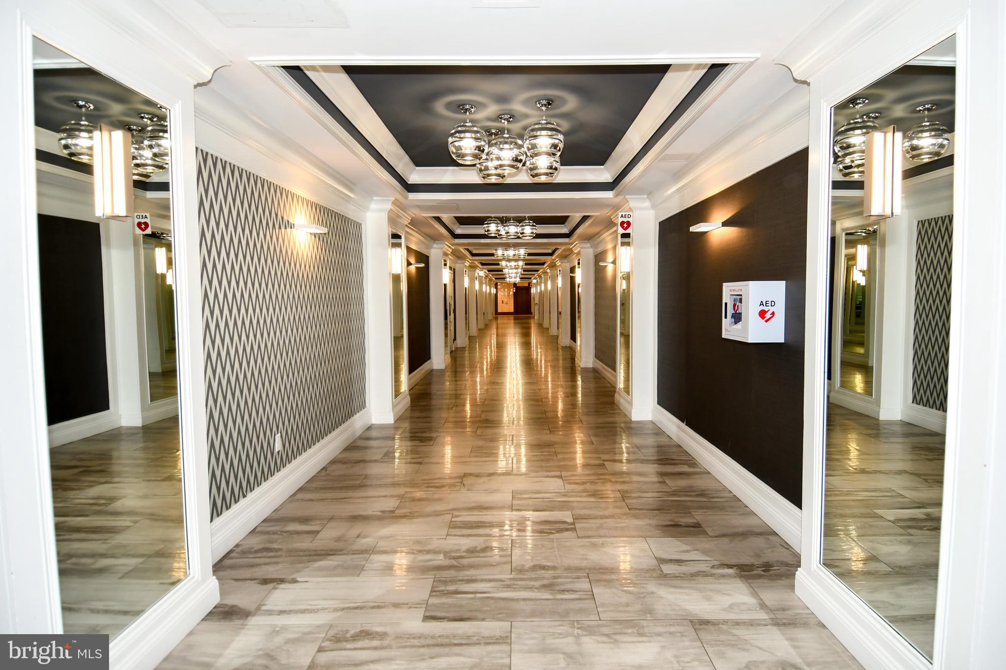 5225 Pooks Hill Road, Unit 222N Bethesda, MD 20814 - Photo 27 of 45 a view of a hallway with a couch