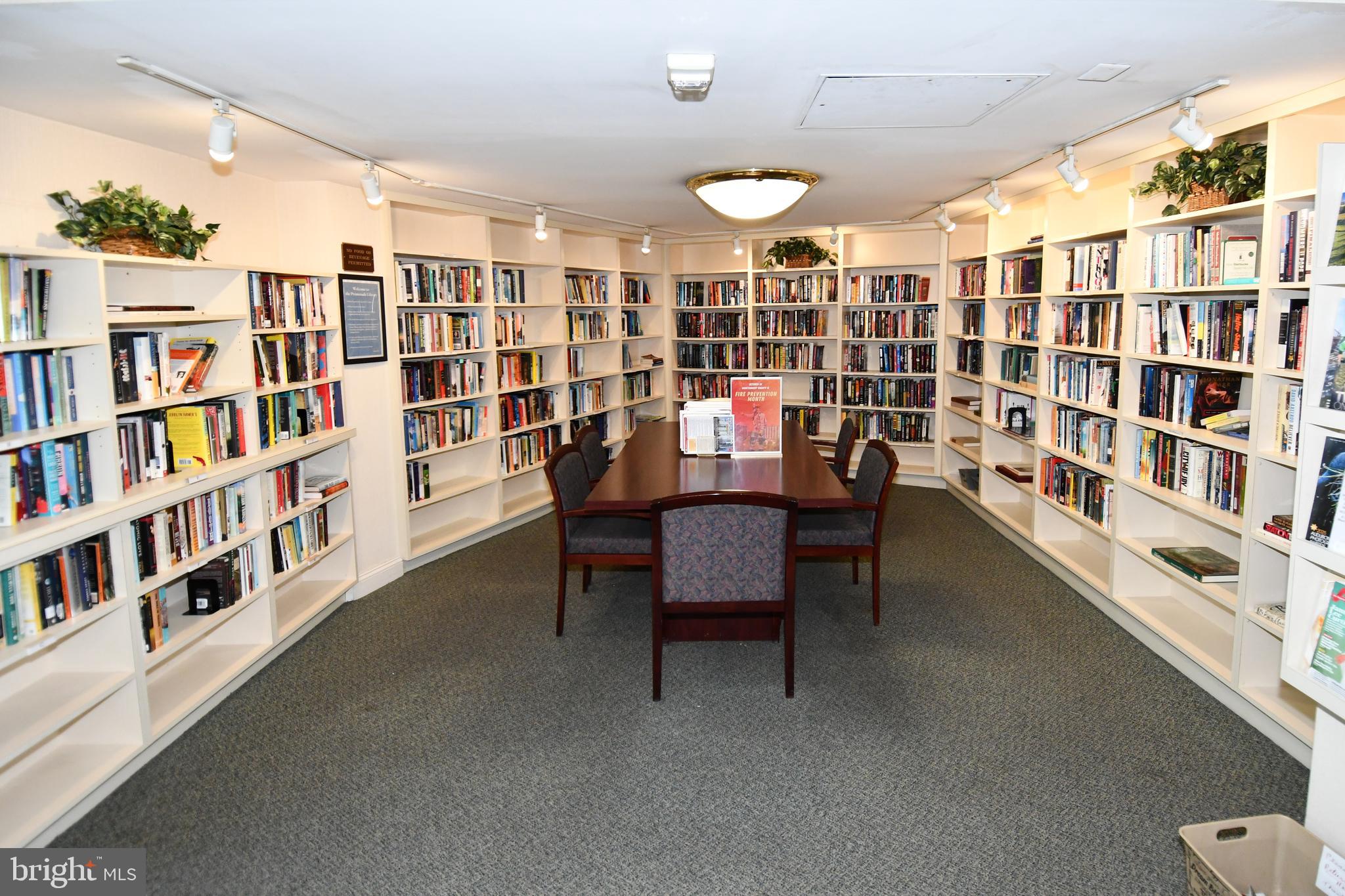 5225 Pooks Hill Road, Unit 222N Bethesda, MD 20814 - Photo 29 of 45 a dining room with furniture and a book shelf
