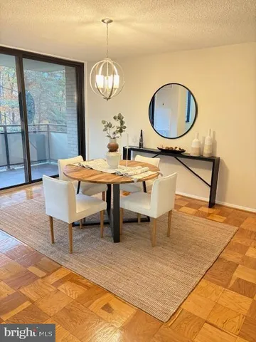 a kitchen with a refrigerator sink and cabinets