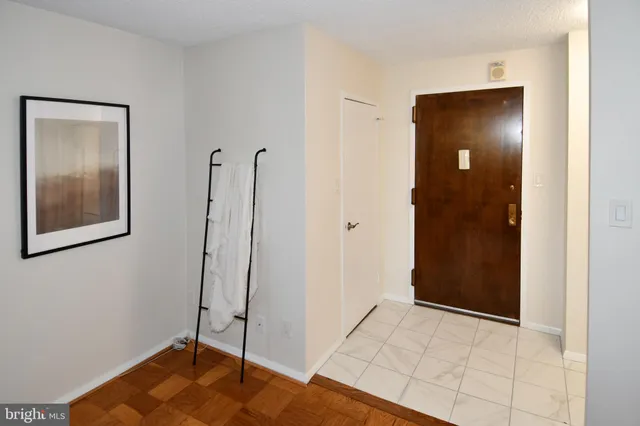 a bedroom with a bed and the view of en suite bathroom