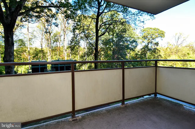 a dining room with furniture and a book shelf