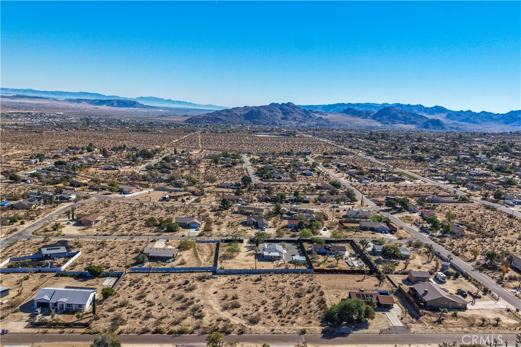 7201 Olympic Road Joshua Tree, CA 92252 - Photo 2 of 12 an aerial view of residential house and green space