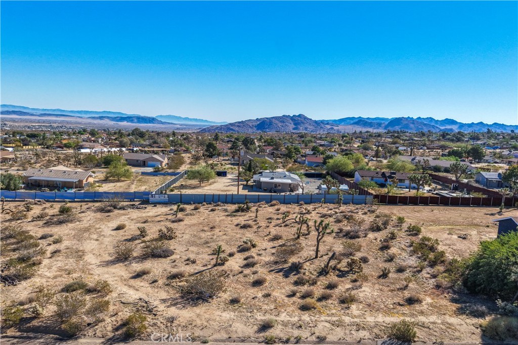 7201 Olympic Road Joshua Tree, CA 92252 - Photo 6 of 12 a view of a town with mountains in the background