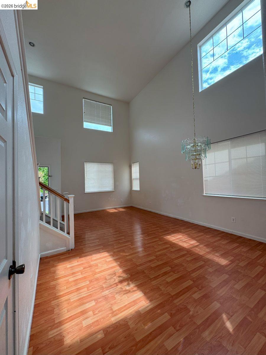 645 Rockspray Circle Pittsburg, CA 94565 - Photo 15 of 31 a view of an empty room with window and hardwood floor