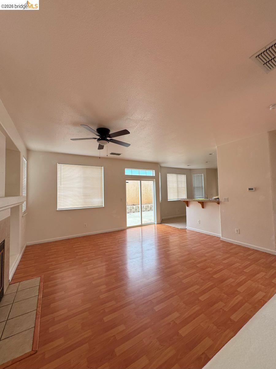 645 Rockspray Circle Pittsburg, CA 94565 - Photo 17 of 31 a view of an empty room with window and wooden floor