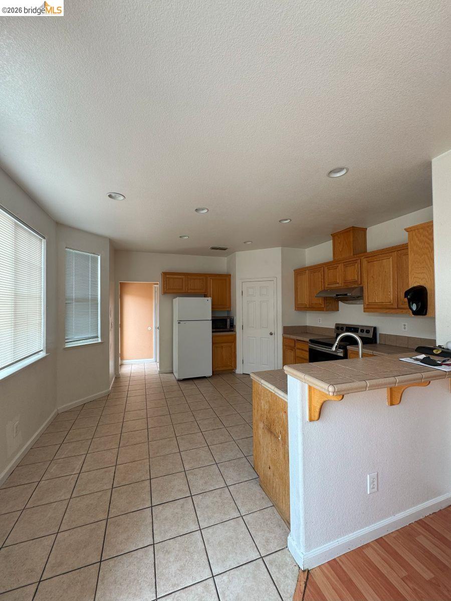 645 Rockspray Circle Pittsburg, CA 94565 - Photo 19 of 31 a view of a kitchen with a sink cabinets and a kitchen counter space