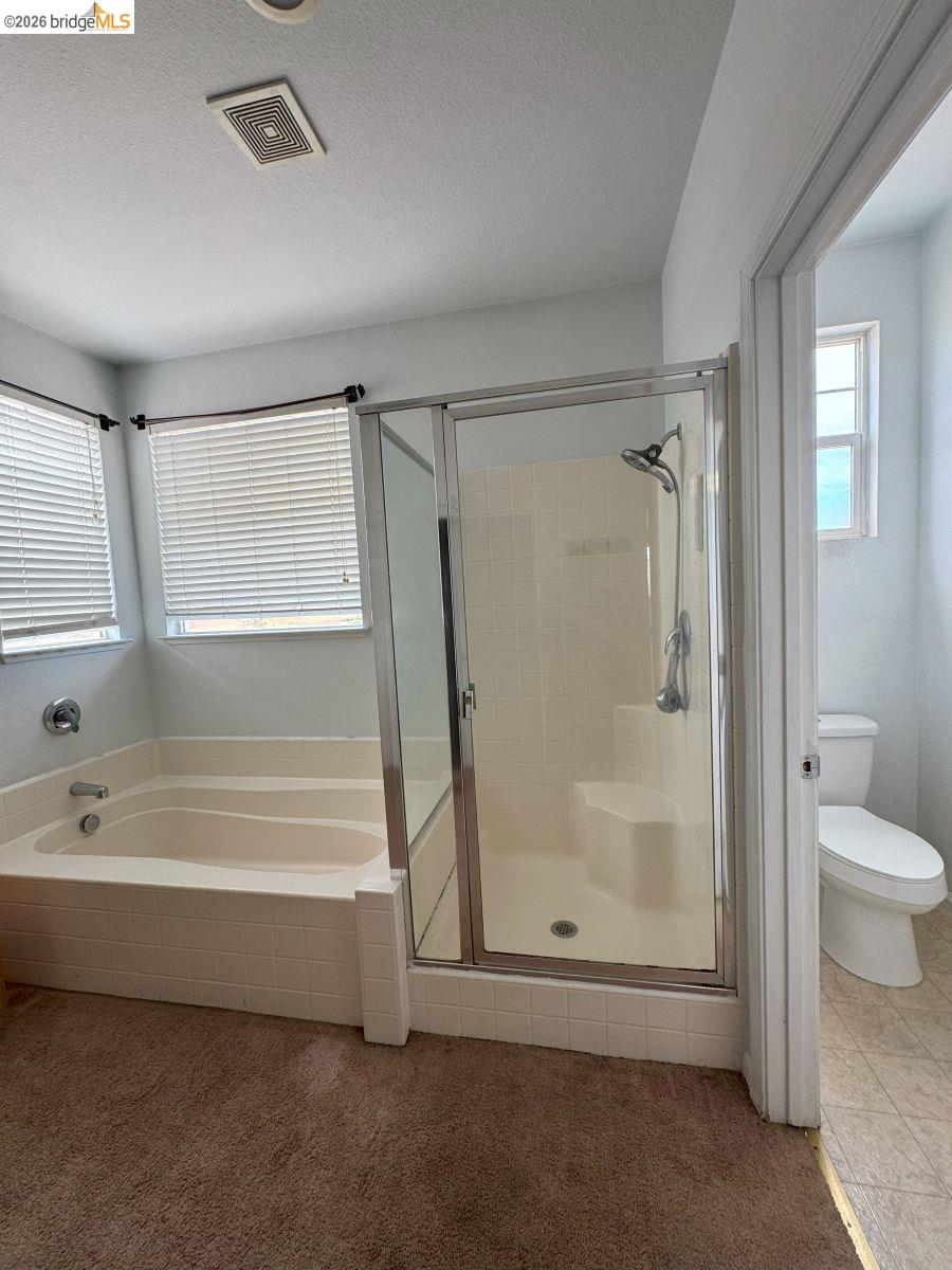 645 Rockspray Circle Pittsburg, CA 94565 - Photo 2 of 31 a bathroom with a bathtub and a shower