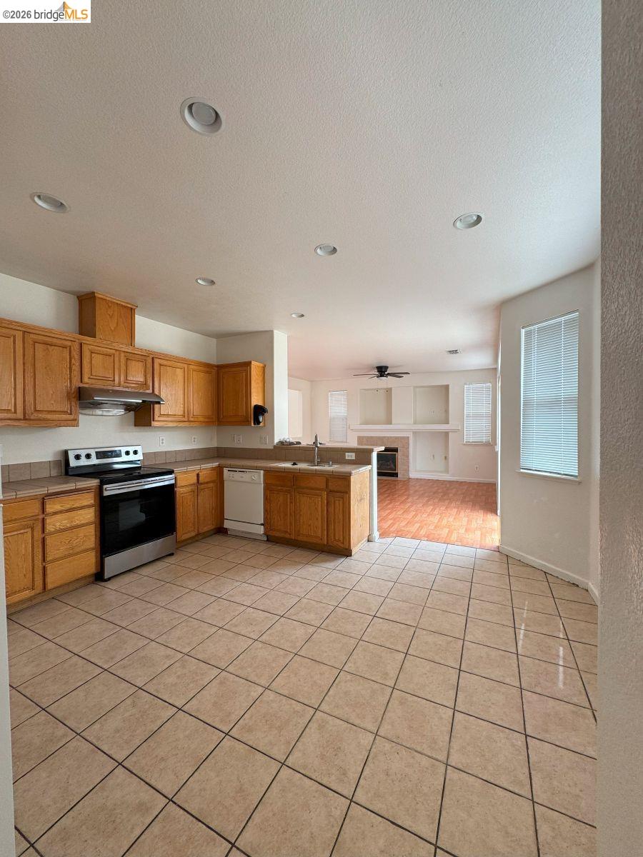 645 Rockspray Circle Pittsburg, CA 94565 - Photo 31 of 31 a large kitchen with cabinets and stainless steel appliances