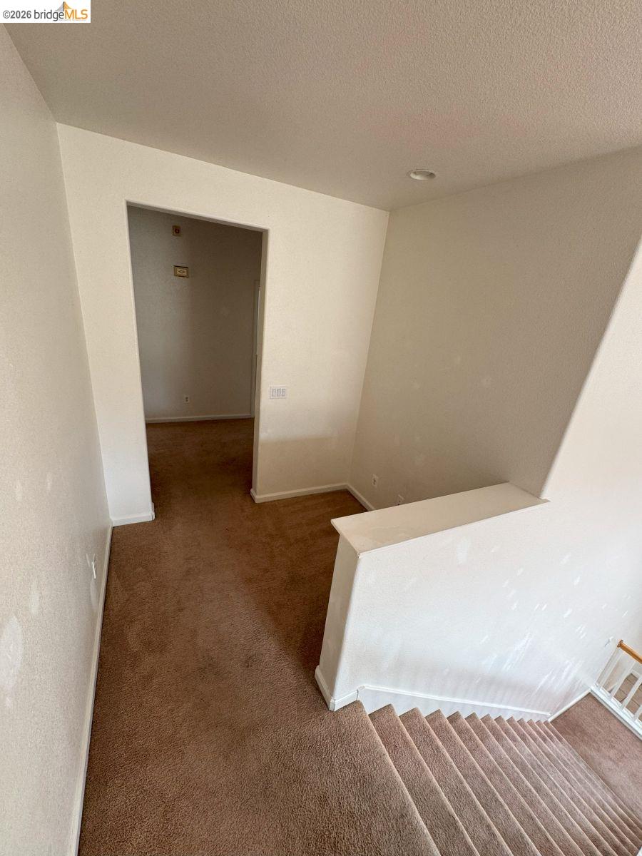 645 Rockspray Circle Pittsburg, CA 94565 - Photo 3 of 31 Corridor featuring carpet floors and a textured ceiling