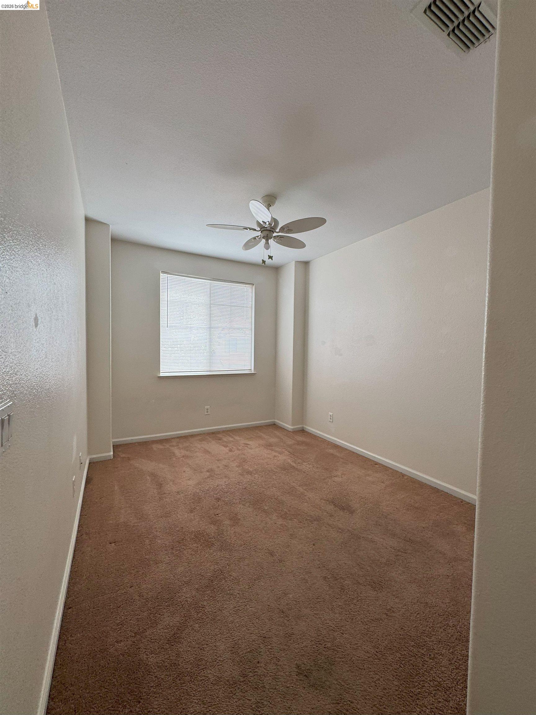 645 Rockspray Circle Pittsburg, CA 94565 - Photo 6 of 31 a view of a livingroom with a ceiling fan and window